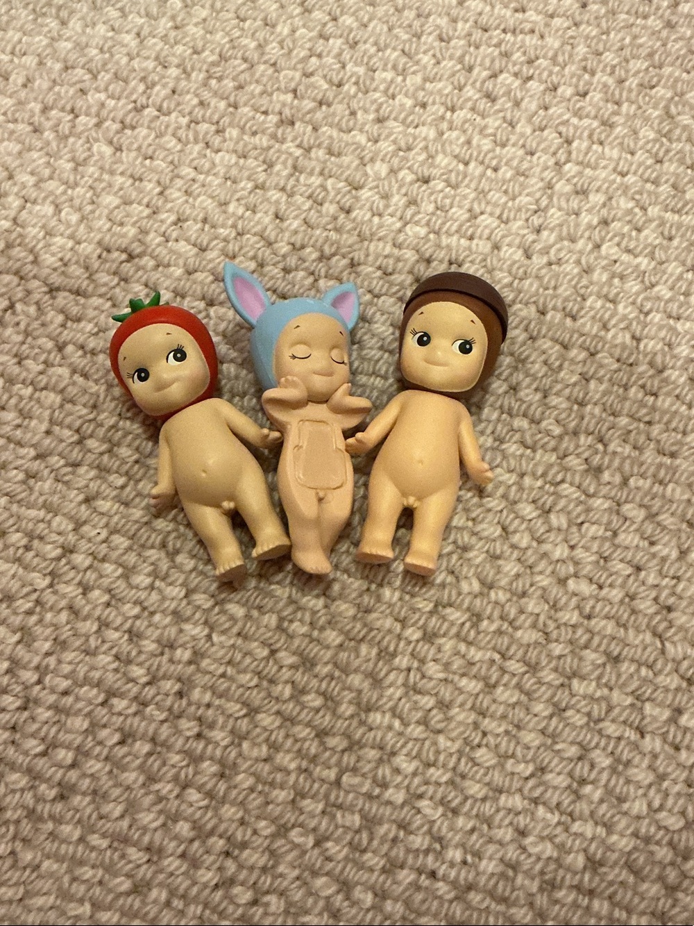 Set of Three Mini Doll Figures with Red, Blue, and Brown Headwear